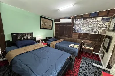 a room with two beds in a room at 64 Sweet Home Dusit BKK in Bangkok