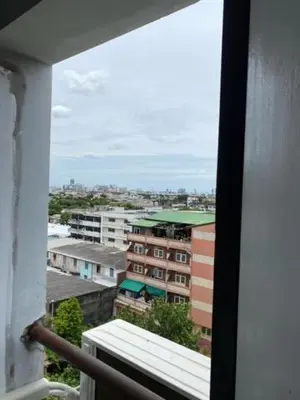 a view of a city from a window of a building at รัตนากร แมนชั่น in Bang Su
