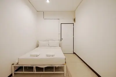 a small white room with a bed in it at XX GO INN Asiatique BKK Charoen krung- โกอินน์ เอเซียทีค เจริญกรุง in Godown