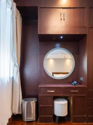 a bathroom with a vanity and a mirror at home22 Private Residence in Bangkok