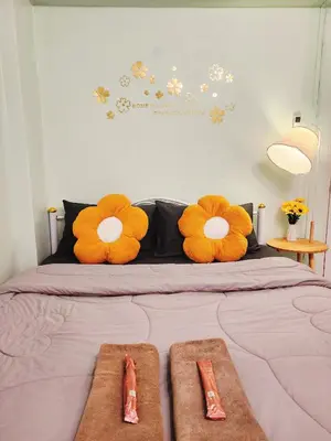 a bed with two large stuffed animals on it at 805-STP Homely room Free Wi-Fi and Near BTS line in Bangkok
