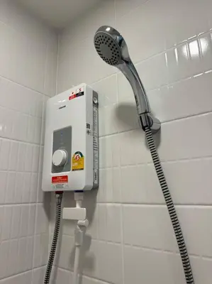 a shower in a bathroom with a shower head at Modern Condo Near Icon Siam & BTS Krung Thonburi in Bangkok