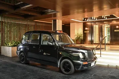 a small black car parked in front of a building at Marriott Executive Apartments, Bangkok Townhall Sukhumvit in Bangkok