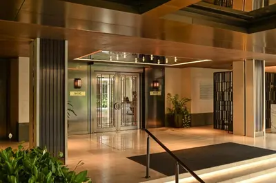 a lobby of a building with a revolving door at Marriott Executive Apartments, Bangkok Townhall Sukhumvit in Bangkok