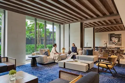 two women sitting in a living room at Marriott Executive Apartments, Bangkok Townhall Sukhumvit in Bangkok