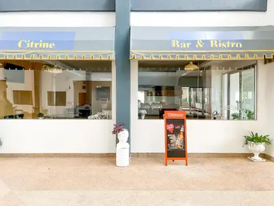 a store front with a sign in front of it at Anda Ramkhamhaeng By St James Hotel in Bangkok