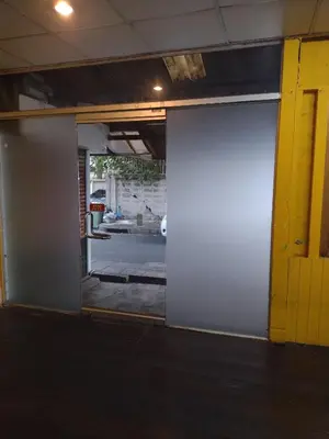 an open door in a room with a view of a garage at 362 สวนอ้อย5 in Dusit
