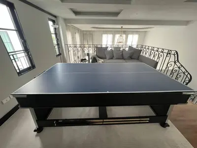 a large ping pong table in a living room at Luxury Pool Villa 5BR 12pax with Private Lift in Ekkamai in Bangkok