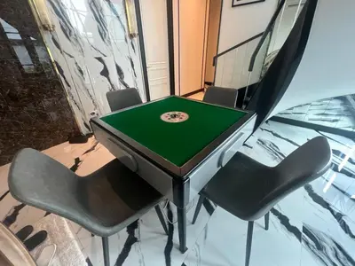 a ping pong table with four chairs in a room at Luxury Pool Villa 5BR 12pax with Private Lift in Ekkamai in Bangkok