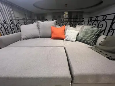 a large bed with four pillows on top of it at Luxury Pool Villa 5BR 12pax with Private Lift in Ekkamai in Bangkok