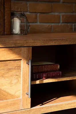 a book shelf with two books on it at Parrish Serviced Apartment in Bang Mote