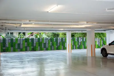 a parking garage with a car parked in it at Parrish Serviced Apartment in Bang Mote