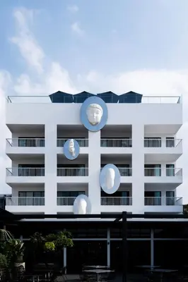 a white building with three large spheres on it at The StandardX, Bangkok Phra Arthit in Bangkok