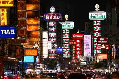 a busy city street at night with many signs at XX GO INN Khaosan Road - Grand Palace in Bangkok