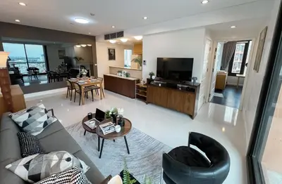 a living room with a couch and a table at Expansive Luxury 2BR - Ultra Fast Wifi - Phrom Phong in Bangkok