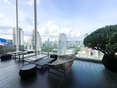 a balcony with benches and a view of a city at Extravagant Apt 65 sqm 1BR - Ultra Fast Wifi - Silom in Bangkok