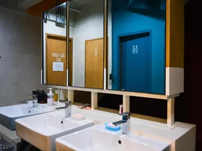 a bathroom with two sinks and a large mirror at BOB Hostel सुख सदन ひだまり庵 파란달여관 in Bangkok