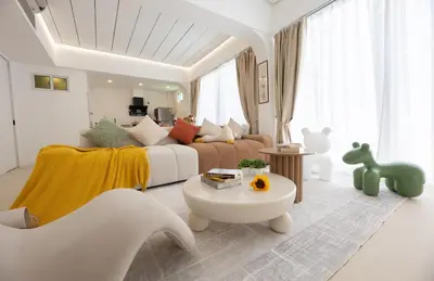 a living room with a bed and a couch at Ratchada Retreat Boutique Suites in Bangkok