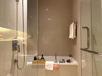 a bathroom with a shower and a sink at Stylish Modern 1BR - BTS Phrom Phong - Ultra Fast WiFi in Bangkok