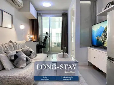 a living room with a long stay apartment at Exclusive Modern Apt - Ultra Fast WiFi - Thong Lo in Bangkok