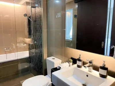 a bathroom with a sink and a toilet and a shower at Tropical Paradise 1BR - Ultra Fast Wifi - Thong Lo in Bangkok