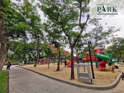 a park with a playground with a slide at Twenty-one BKK House in Bang Kapi