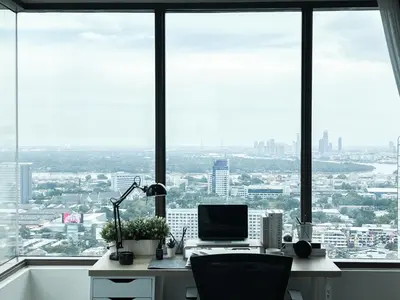 an office with a desk with a computer on it at The Grand Penthouse 2BR Ultra Fast WiFi Sukhumvit in Bangkok