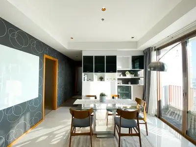 a dining room with a table and chairs at The Grand Penthouse 2BR Ultra Fast WiFi Sukhumvit in Bangkok