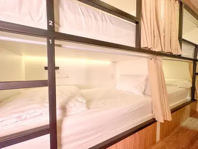 a couple of bunk beds in a room at Bangkok Neighborhood Hostel in Bangkok