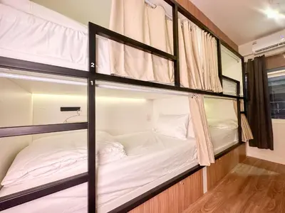a bunk bed room with two bunk beds at Bangkok Neighborhood Hostel in Bangkok