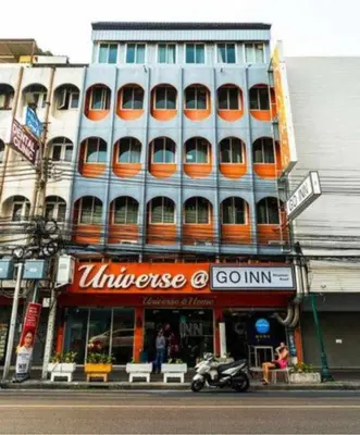 a building on a city street with a motorcycle in front at XX GO INN Khaosan Road BKK - Grand Palace in Bangkok