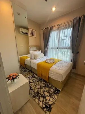 a bedroom with two beds and a window at Minimal 2 BR next to IKEA, Central Westgate Bangyai in Ban Bang Krabu