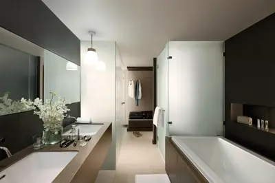 a bathroom with two sinks and a bath tub at Happy 3 in Bangkok