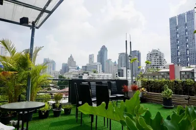 a balcony with a view of a city skyline at Hash Apartment Silom Soi 3 triple room in Bang Rak