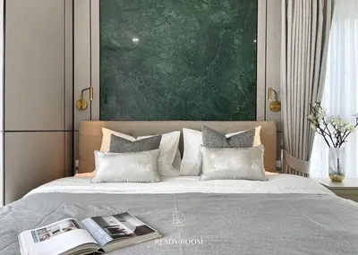 a bedroom with a large bed with a book on it at Luxury room in Ban Khlong Bang Chak