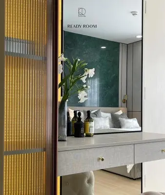 a bedroom with a bed with a large mirror at Luxury room in Ban Khlong Bang Chak