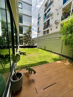 a potted plant sitting on a porch with a yard at 5 mins to Ari - Sutthisan in Bang Su