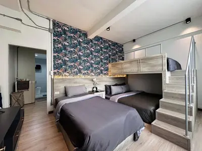 two beds in a room with a bunk bed at Sweet stay in Bangkok