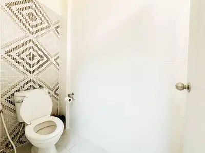 a bathroom with a white toilet in a room at 5BR House 8Beds, Ekkamai BTS 12mins walk, 711, shopping mall in Bangkok
