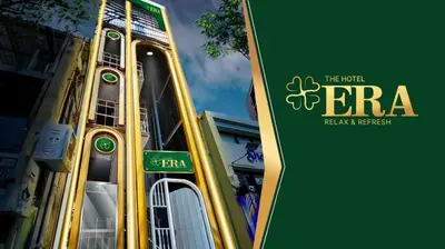 a sign for the hotel erra in front of a building at The Hostel Era in Bangkok