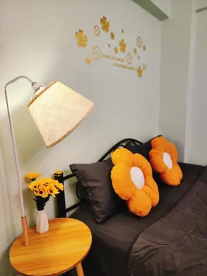 two stuffed animals sitting on a couch with a lamp at 807-STP Homely room Free Wi-Fi and Near BTS line in Ban Yang