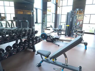 a gym with a lot of equipment in it at The Chapter One Lifestyle Condo in Bang Khen