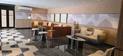 a lobby with a couch and chairs and tables at The Chapter One Lifestyle Condo in Bang Khen