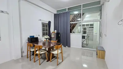 a dining room with a table and chairs at NAN Square in Pratunam