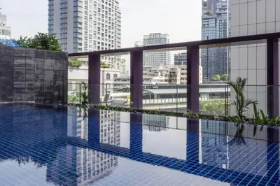 a swimming pool on the roof of a building at Luxury Condominium in Bangkok