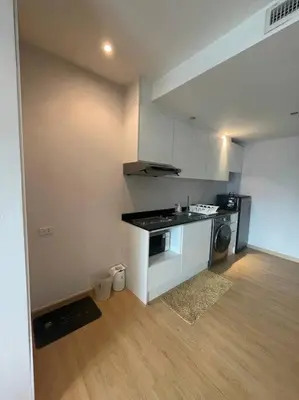 a small kitchen with a stove and a sink at Luxury Condominium in Bangkok