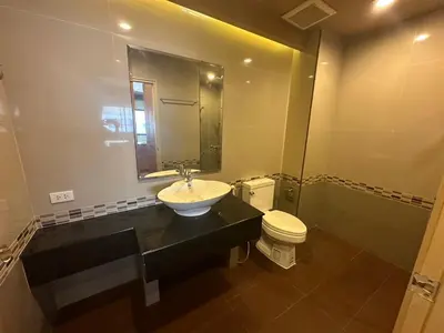 a bathroom with a sink and a toilet at Le Ram Hotel No window in Bangkok