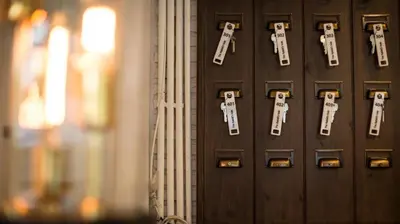 a close up of a wooden door with keys on it at The rabbit's hole hostel in Bangkok