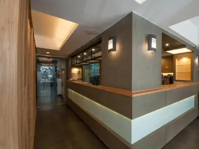 a lobby of a restaurant with a counter at Cozy At 9 Hotel And Kitchen in Bangkok
