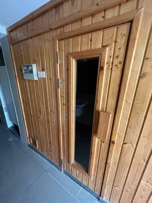 a wooden building with a toilet in it at Central 2BR 3 min walk from BTS Ploen Chit in Makkasan